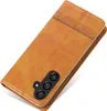 A brown leather phone case with a camera cutout is shown against a white background. Produktbild-Vorschau