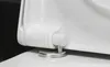 A close-up shot of a white toilet seat hinge mechanism. Produktbild-Vorschau