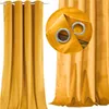 A close-up view of a mustard yellow velvet curtain with grommets. Produktbild-Vorschau