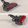 A close-up view of a vacuum cleaner head on a carpet. Produktbild-Vorschau