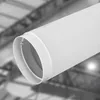 A close-up of a white ventilation pipe connector against a blurred industrial background. Náhľad obrázku produktu
