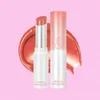 Two lip balms are shown against a pink background with a smear of product behind them. Náhľad obrázku produktu