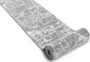 A rolled-up runner rug with a stone-like pattern is shown on a white background. Produktbild-Vorschau