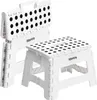 Two white folding step stools with black polka dots on a white background. Produktbild-Vorschau