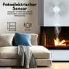 A living room scene with a couch, fireplace, and a smoke detector on the wall. Produktbild-Vorschau