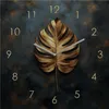 Wanduhr Metall 30x30cm Schwarz Gold Wanddeko Monstera Blatt Produktbild-Vorschau 1