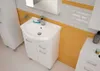 A white bathroom vanity with a sink and faucet, set against yellow tiles and white brick-patterned walls. Voir les images du produit