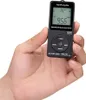A hand holding a small black portable radio. Náhled obrázku produktu