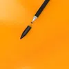 A black stylus pen with a silver tip is shown on an orange background. The pen is disassembled, with the cap removed. Podgląd zdjęcia produktu