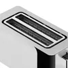 A close-up view of the top slots of a toaster. Voir les images du produit