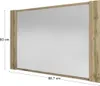 A mirror with a wooden frame, shown in a studio setting with dimensions indicated. Náhled obrázku produktu