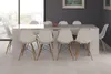A dining table and chairs set in a modern dining room. Produktbild-Vorschau
