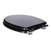 A black toilet seat with chrome hinges is shown against a white background. Náhled obrázku produktu