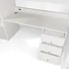 A close-up view of a white desk with drawers. Podgląd zdjęcia produktu