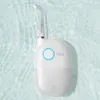 A white water flosser is submerged in clear, rippling water. Náhled obrázku produktu