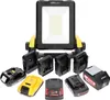 A work light with multiple battery adapters and batteries. Produktbild-Vorschau