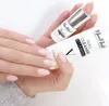A hand with manicured nails holding two NeoNail products. Podgląd zdjęcia produktu