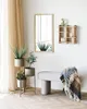 A bright and airy room with plants, a mirror, and a bench. Podgląd zdjęcia produktu