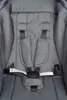 A close-up view of a gray stroller seat with a 5-point harness system. Náhľad obrázku produktu