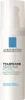A white bottle of La Roche-Posay Toleriane Sensitive Fluido with text and a blue square logo. Náhľad obrázku produktu