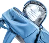 A close-up view of the inside of a blue backpack, showing a name tag. Voir les images du produit