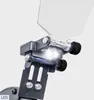 A close-up view of the LED lights and magnifying glass attachment on a grinding machine. Náhľad obrázku produktu