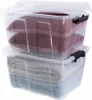 Two clear plastic storage boxes stacked on top of each other, filled with folded blankets and pillows. Produktbild-Vorschau