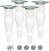 Four white wooden furniture legs with metal mounting plates, screws, and felt pads. Podgląd zdjęcia produktu