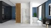 A modern bathroom with a shower cabin, bathtub, and seating area. Produktbild-Vorschau
