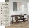 A TV stand with media console and decorative items in a living room setting, with a text-heavy informational overlay on the left. Produktbild-Vorschau