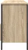 Side view of a cabinet with a wood grain finish and black metal legs. Voir les images du produit