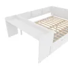 A close-up, angled view of a white children's bed frame with a slide attachment and built-in shelves. Produktbild-Vorschau