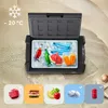 A portable cooler filled with ice and drinks, placed on a sandy beach. Anteprima dell’immagine prodotto