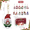 A collection of Christmas-themed diamond painting keychains and a diamond painting kit box. Produktbild-Vorschau