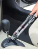 A hand is using a handheld vacuum cleaner to clean the center console of a car. Anteprima dell’immagine prodotto