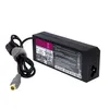 A black laptop power adapter with its cable is shown against a white background. Produktbild-Vorschau