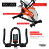 A split image showing the top half of an indoor cycle bike with feature callouts and the bottom half showing the handlebars and display. Produktbild-Vorschau