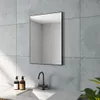 A bathroom setting with a mirror, sink, and faucet. Produktbild-Vorschau