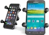 Two smartphone holders are shown against a white background. One is angled and the other is upright. Náhled obrázku produktu
