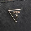 A close-up shot of the Guess logo on a black textured surface. Produktbild-Vorschau