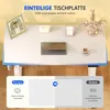A top-down view of a white desk with various items on it, including a framed picture, a small white object, a gold and gray organizer, and a cup of coffee. The bottom of the image shows a comparison between 'Flexispot' and 'Andere' desk tops. Produktbild-Vorschau