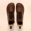 A top-down view of a pair of brown leather boots. Voir les images du produit
