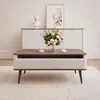 A coffee table with a drawer and a bouquet of flowers on top, placed in a living room setting. Voir les images du produit