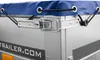 Close-up of a trailer corner with a blue tarp secured by bungee cords and a metal latch. Podgląd zdjęcia produktu