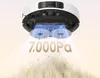 A white robot vacuum cleaner is shown from underneath, demonstrating its cleaning function with debris being lifted. The text "7,000Pa" is displayed prominently. Produktbild-Vorschau