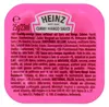 A close-up of a small pink pot of Heinz Curry Mango Sauce. Produktbild-Vorschau
