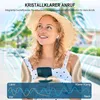 A woman wearing a straw hat and a polka dot dress is smiling while holding a smartphone and wearing earbuds. The background shows a blurred outdoor scene with trees and sunlight. Overlays illustrate sound waves and a graph comparing noise reduction. Produktbild-Vorschau