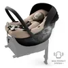 A baby car seat with a mannequin inside, shown on a white background with a grey base. Produktbild-Vorschau