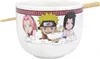 A white ramen bowl with cartoon characters from Naruto Shippuden printed on it, and chopsticks resting on the rim. Podgląd zdjęcia produktu