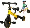 A yellow 3-in-1 trike with a child riding a similar trike in the background. Podgląd zdjęcia produktu